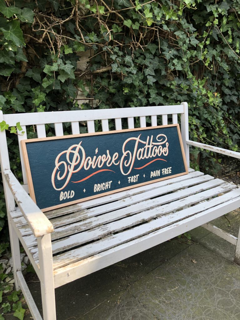 Handpainted sign for Poivre Tattoos