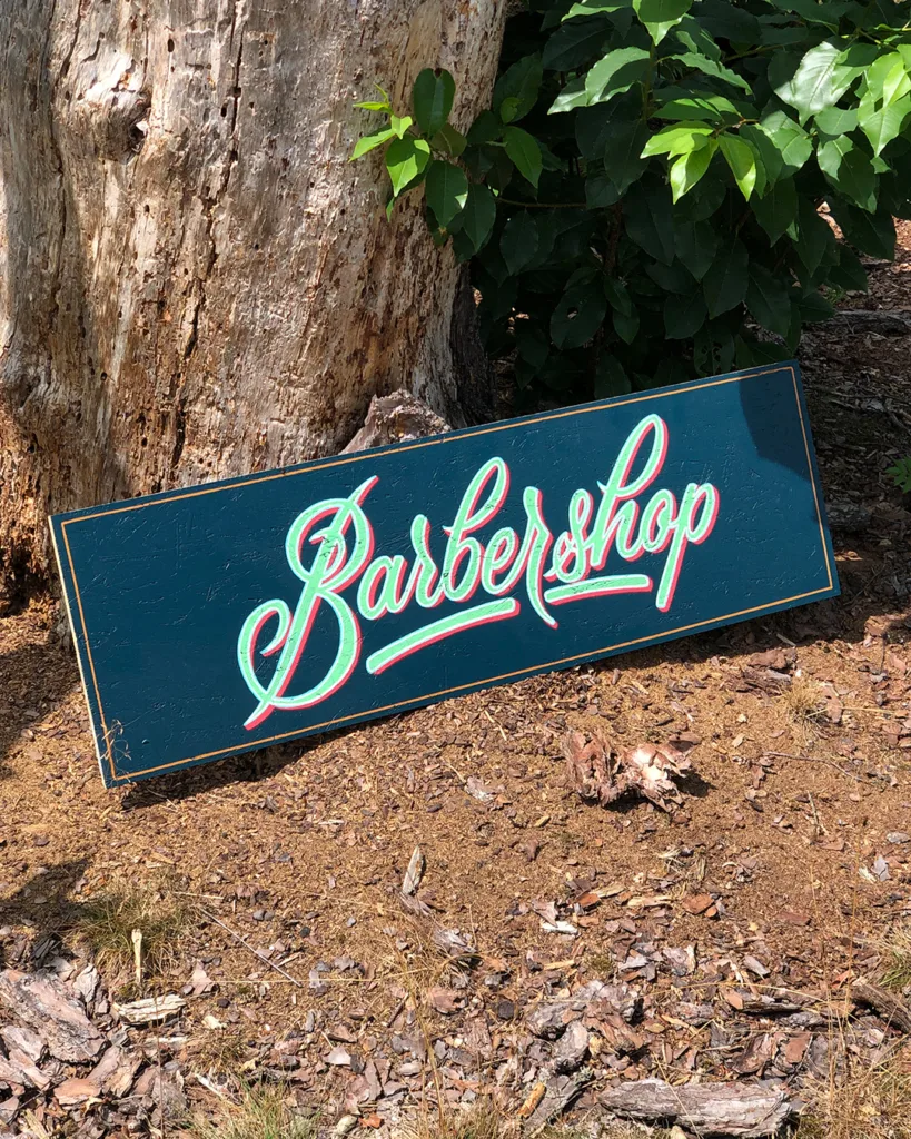 Handpainted barbershop sign by Uncle Vinny