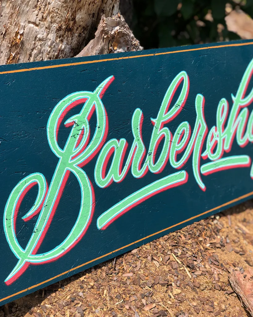 Handpainted barbershop sign by Uncle Vinny